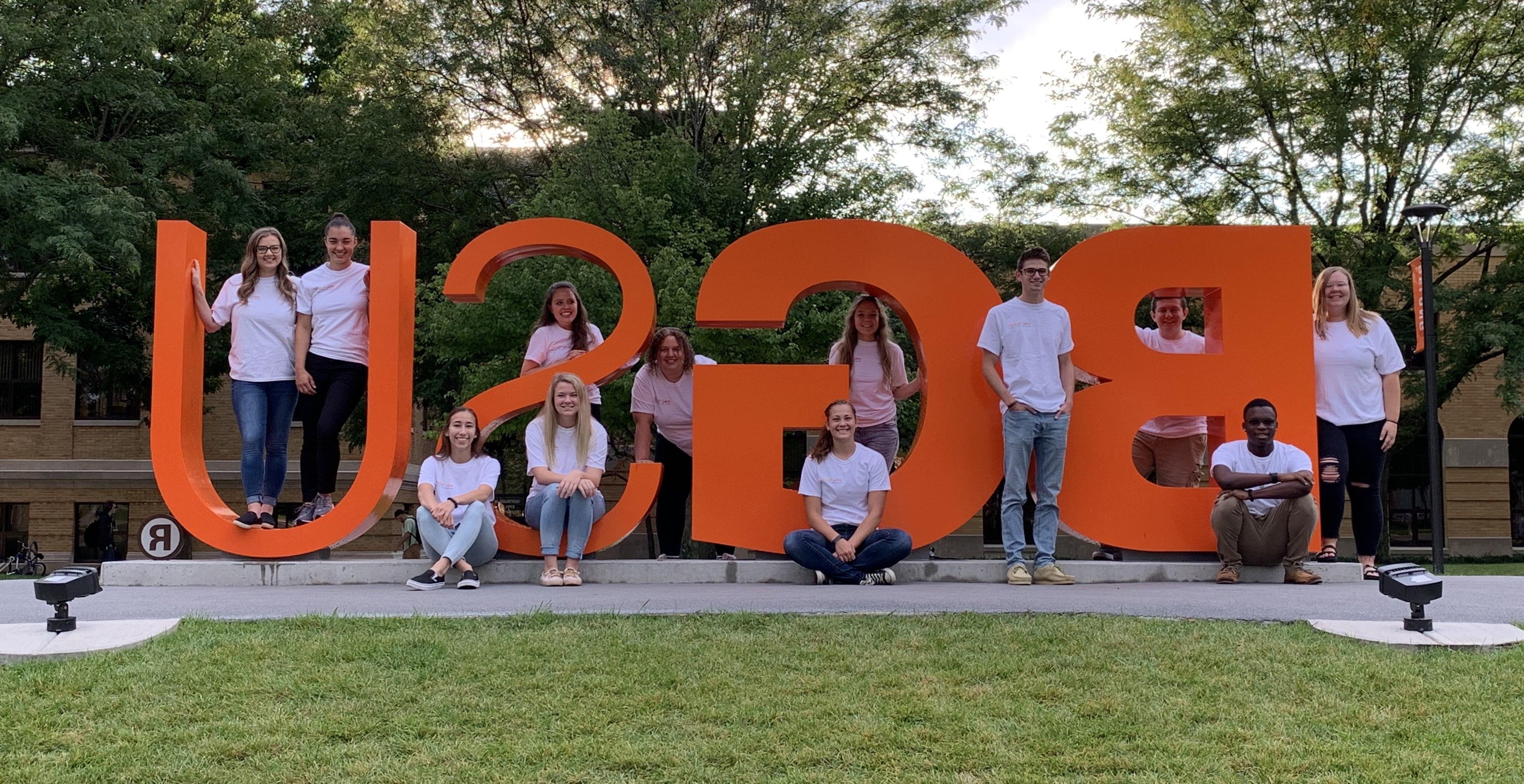 Fall 2019 Research Assistants for the Police Integrity Research Group posing at the BGSU letters.